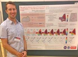 photo: Dr. Austin Todd by his poster